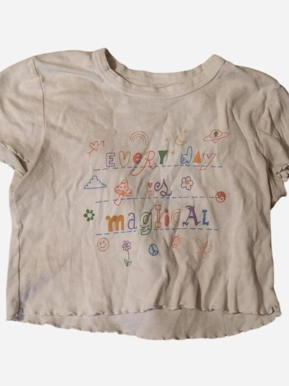 light blue crop top with 'every day is magical' graphic and small illustrations